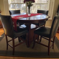 Dark Wood and Black Leather Chairs (synthetic)