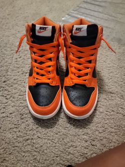 Orange and black Nike Dunks high top