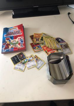 LOTS OF POKEMON CARDS and a book