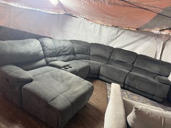Gray recliner couch great condition clean it has four recliners total, including the big Chase one it reclines back