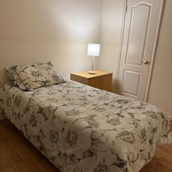 Two Twin Beds With Mattresses And Bedding 