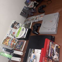 Múltiple Game Consoles With Games 