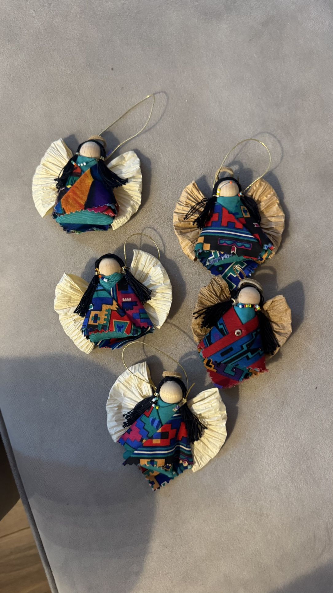 Homemade southwestern looking angel ornaments, five of them