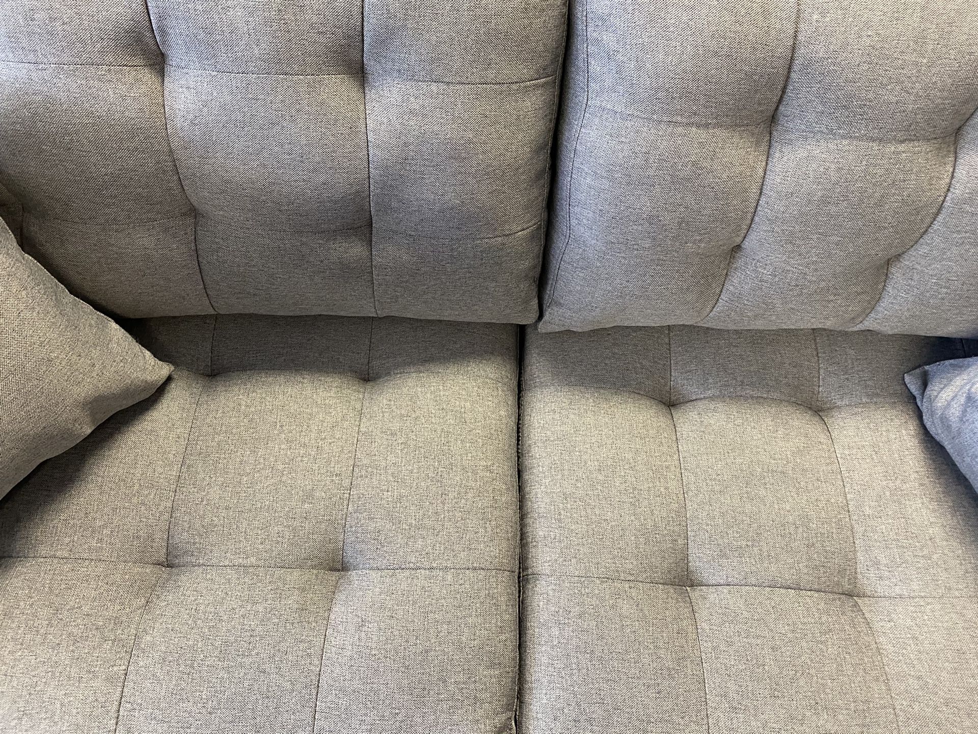 Grey fabric sofa and loveseat