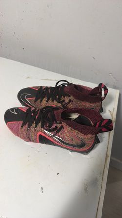 Pink and black untouchable cleats 9.5