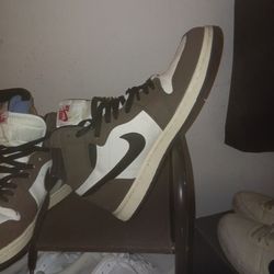 Nike Air Jordan 1 Retro High x Travis Scott sneakers.
