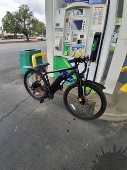 Q Life Racer E Bike with helmet and gloves