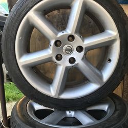 4 used tires and wheels oem Nissan