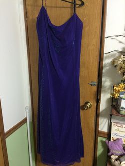 Beautiful dress!! Floor length.. Shimmering purple, teal, blue with beaded straps.. Zip closure in back.. Fits size 16-18