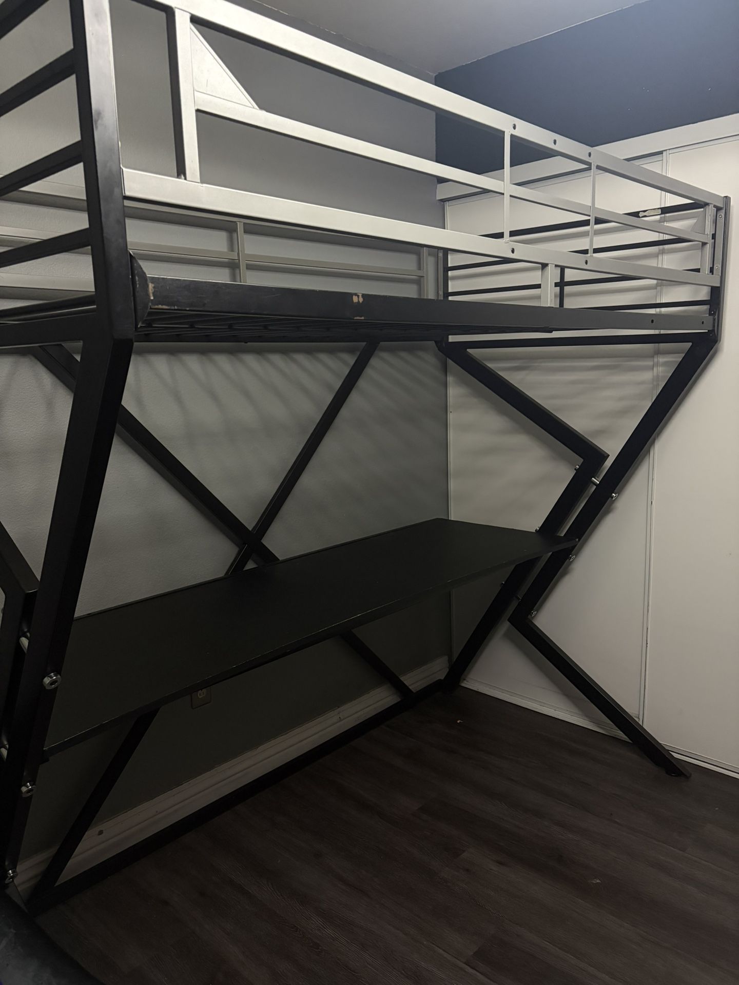 Twin Size bed with desk underneath.