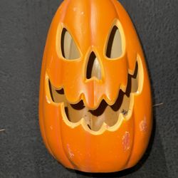 Battery-lit large plastic pumpkin.