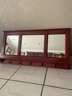 Mirror with hangers