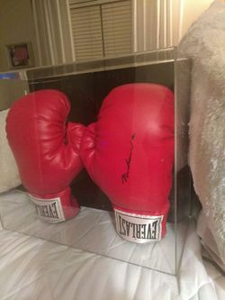 Authentic hand signed Muhammad Ali everlast boxing gloves in UV protected display case has numberd certified hulagram