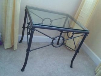 Grey metal framed glass top table