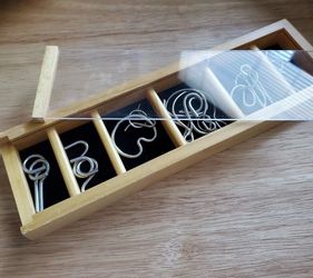 Coffee Table  Brain Stimulating Entertainment Metal Puzzle Links in Wooden Box with Sliding Acrylic Lid