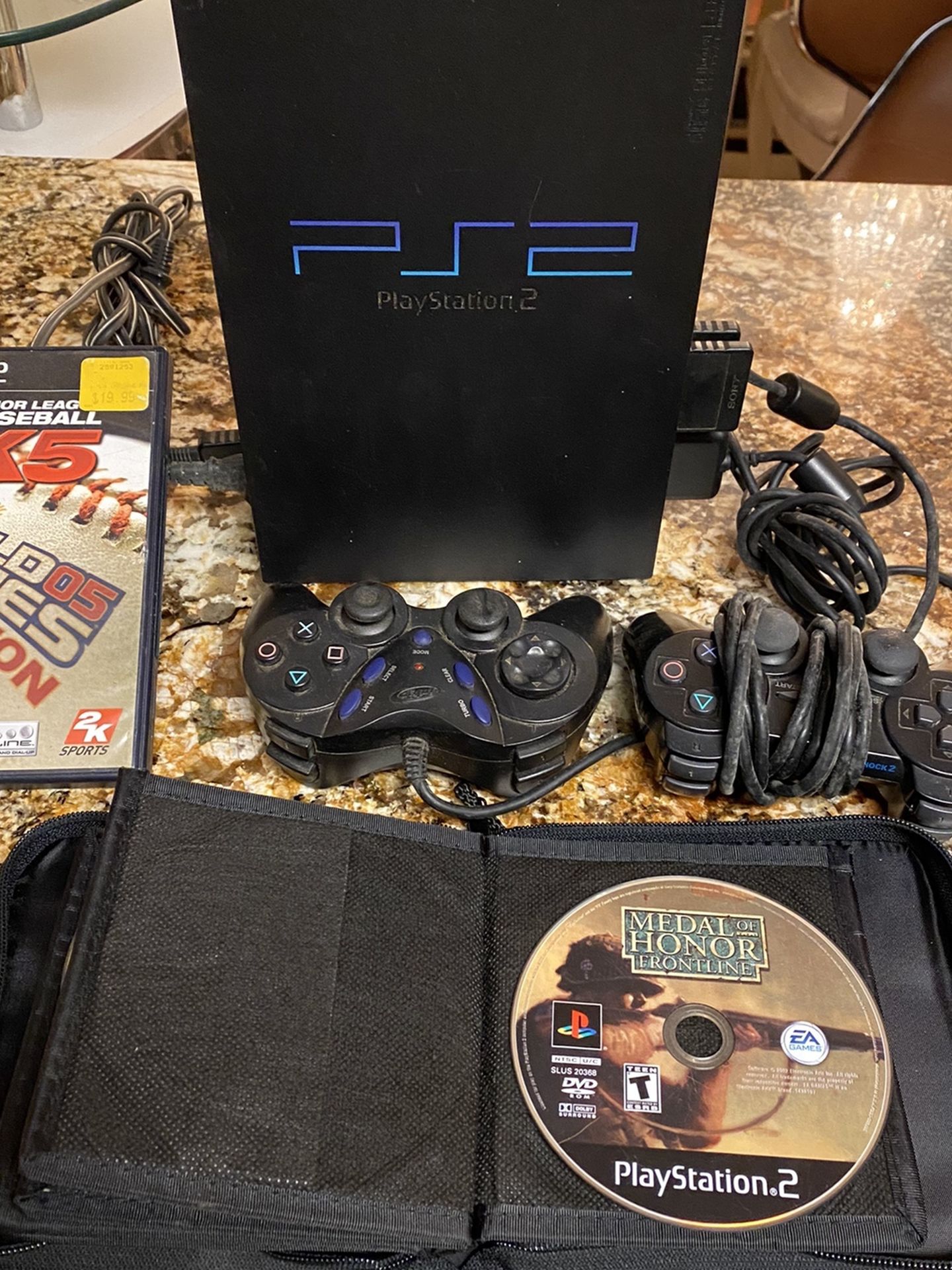 PS2 Game comes with two controllers and a couple games