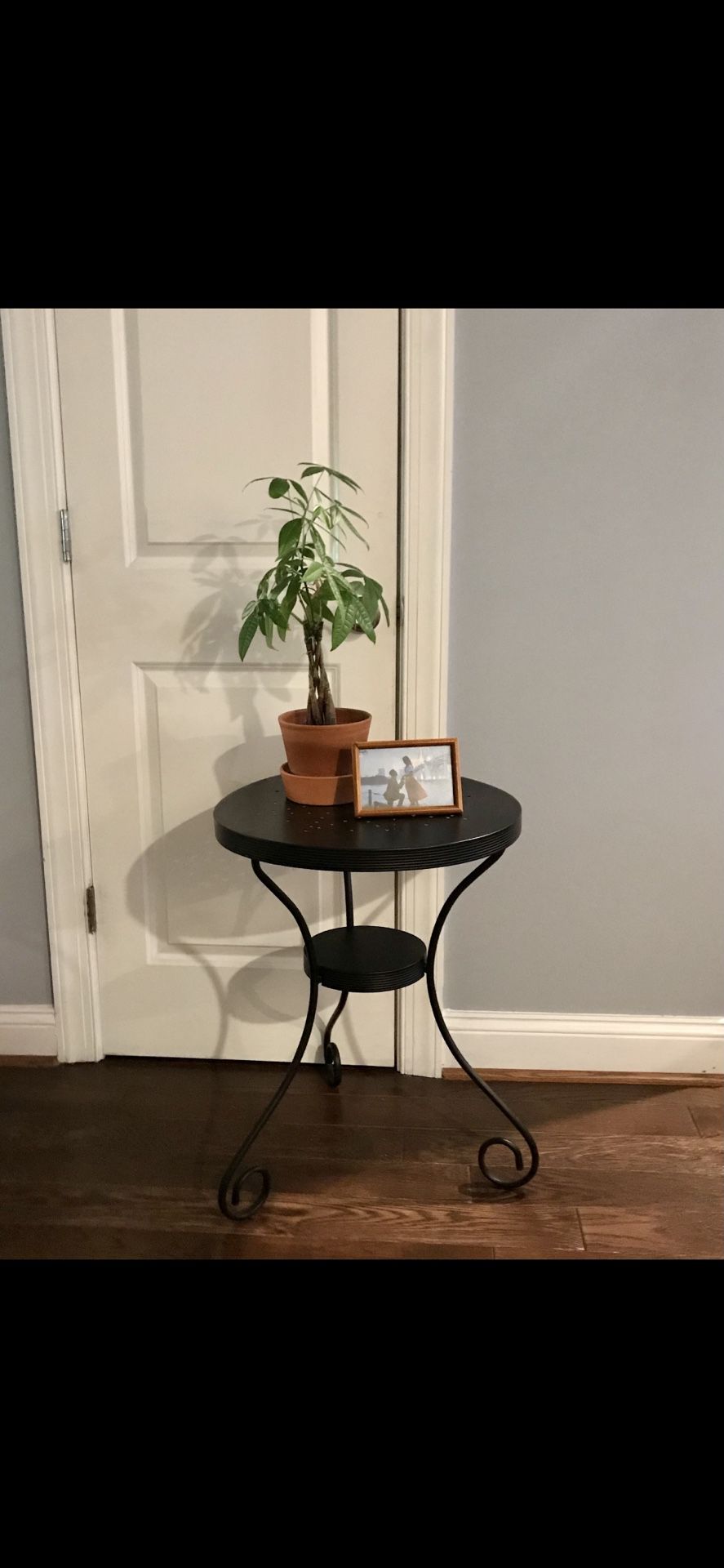 Black metal plant stand, patio table, o rend table