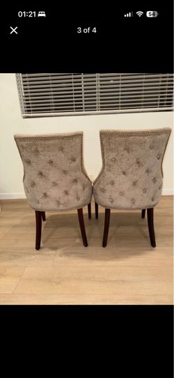 Velvet tufted captain chairs