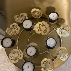 Beautiful home decor. Never lit the candles. Don’t have room anymore for it. About 12” diameter