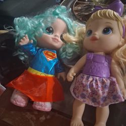 2 bubble dolls. One superwoman Bubble doll.The other is a little girl with a purple bow 