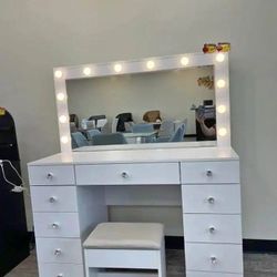 Makeup vanity with mirror glass top