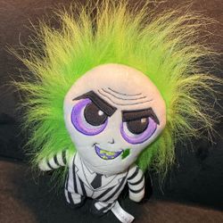 Beetlejuice plush excellent condition  iconic character signature black and white striped suit, black boots, and wild green hair. The doll has a detai