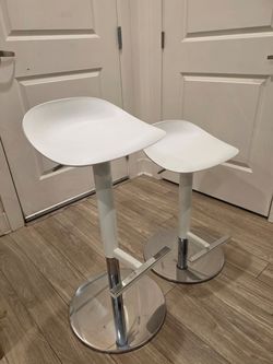 Set of two white adjustable bar stools