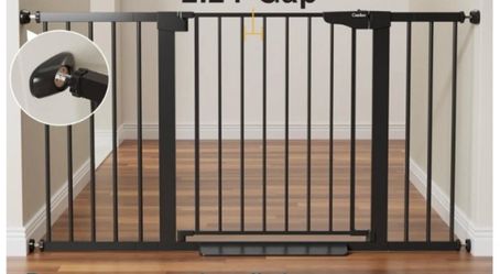 Cumbor Safety Gate  the safety gate adjusts to fit openings between 29.7 and 46 inches wide new