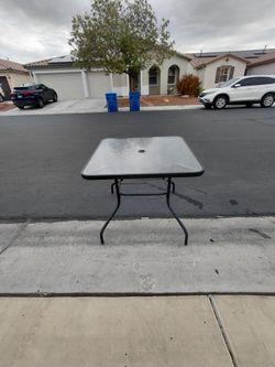 Outdoor glass top table