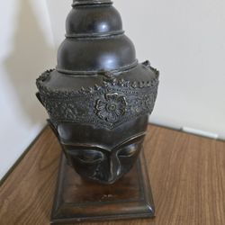 Solid BronzeTibetan Buddha head, likely from the 18th or 19th century. On Wood Stand