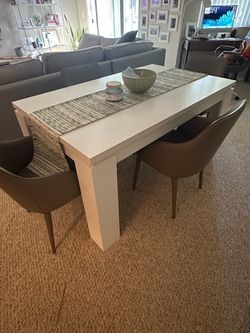 White laminate dining table