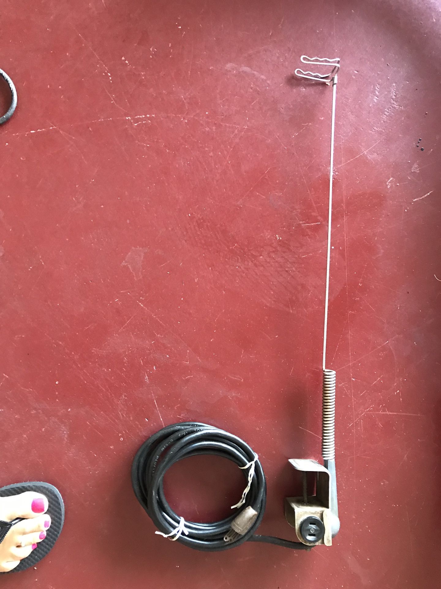 Ironing board cord holder