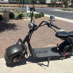 (2)   1 Pink & 1 Black West Coast Scooters 
