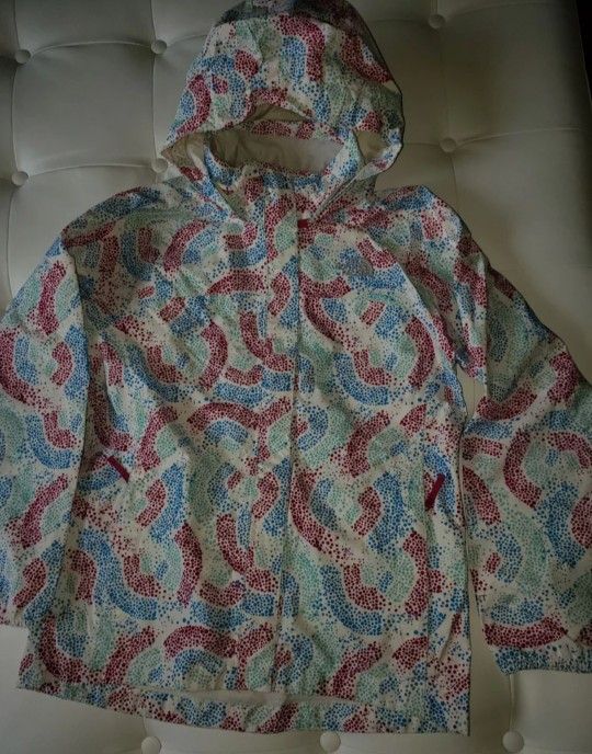 The North Face Girl's Jacket 2 in 1. Size L/G. Very good condition. Made in Vietnam. The color is blue, red, and green.