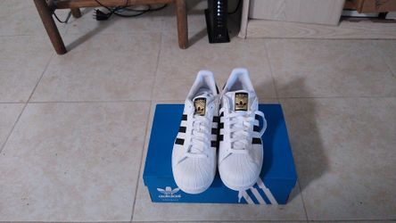 Adidas men's Superstar tennis shoes . Size 13. Show your passion for fashion when you sport these iconic classics.