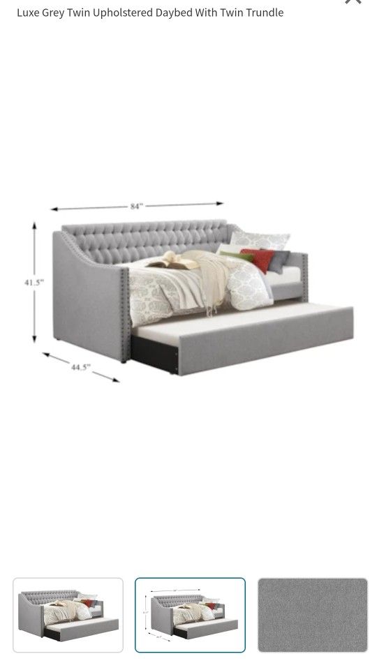 Grey twin day bed with trendle underneath
