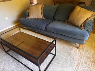 IKEA Stockstud couch with coffee table and pillows