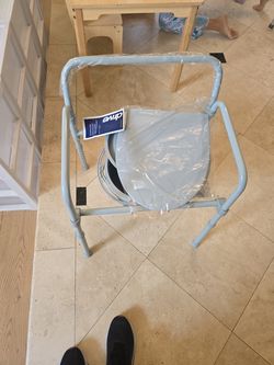 Bed side commode new still in packaging