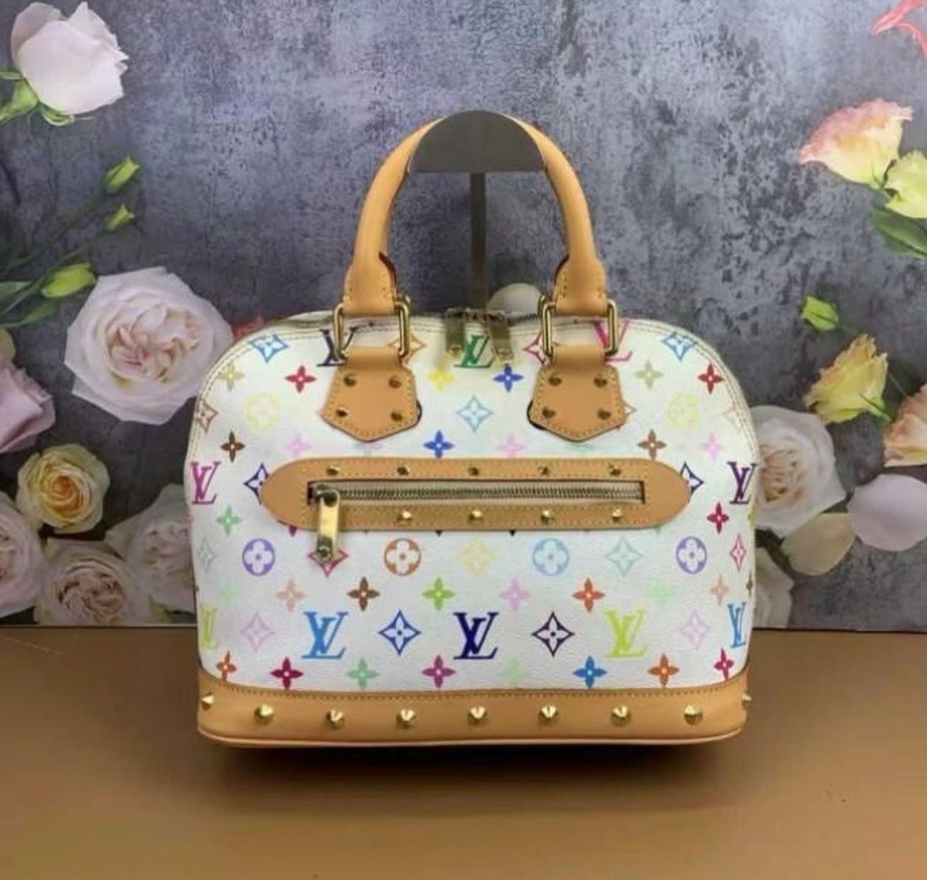 Louis Vuitton Multicolor Alma Handbag We guarantee that all items are authentic. In excellent condition. The Monogram canvas exterior is flawless! The