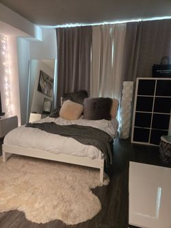 Moving out of state. Free, perfectly new IKEA queen bed frame and storage unit.
