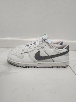 Nike Dunk Low SE 'Winter Storm' sneaker with a summit white, metallic silver, and glacier ice colorway