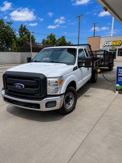 F250 flat bed & trailer