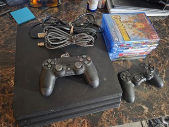 PS4 pro 1Tb with games and two controllers.