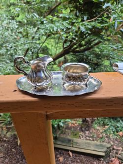 Creamer and sugar bowl on small tray