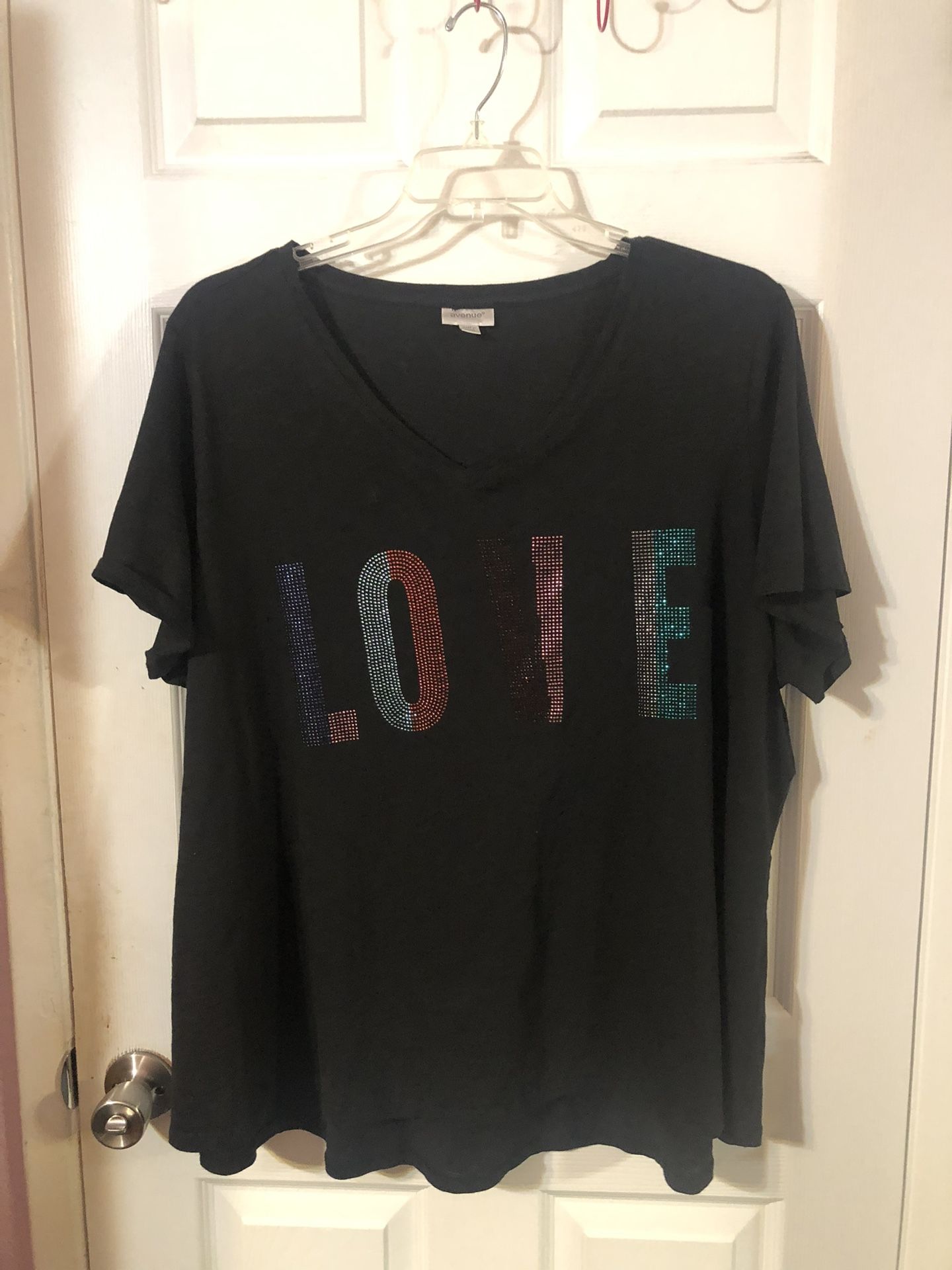 Women’s Size 26 / 28 Tunic Length Top Color Black Says love In Sequence.  Brand New Never Wore.  Brand Avenue .  Has been hanging in the closet.