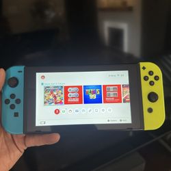 Nintendo Switch With Mario Kart, Cars, And Ninja Turtles