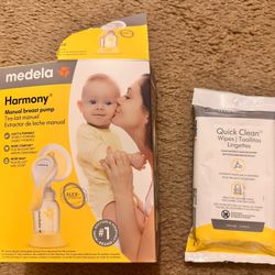 Medela Manual Pump and with a milk collector and quick clean wipes 