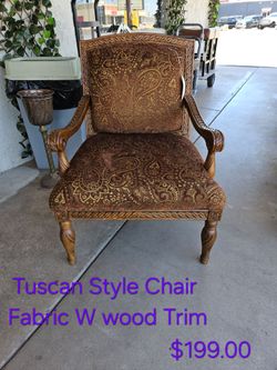 Tuscan Style Accent Chair with Wood Trim We are located at 2811 East Bell road. Another Time Around Furniture.
