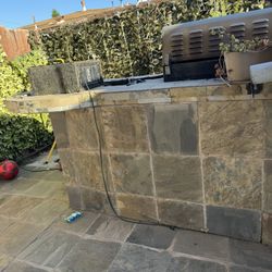 concrete bbq island with Grill. 