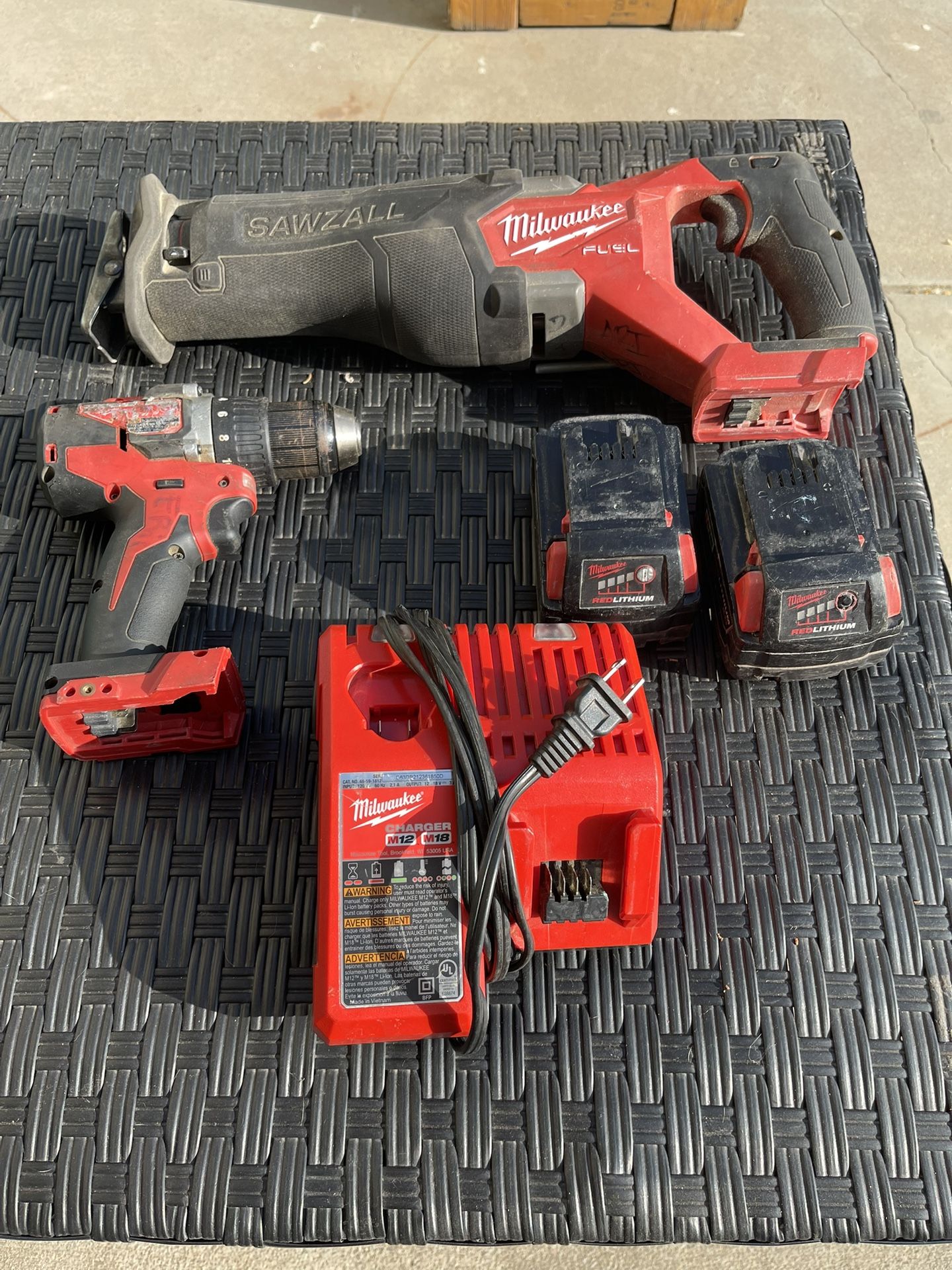 Milwaukee Sawzall And drill. 2 5.0 Batteries